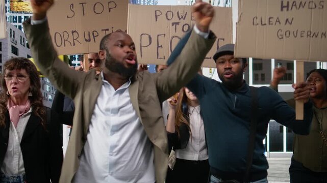 People and activists protesting against corruption during a public march, holding signs and banners to demand justice and transparency. political protest driven by anger and awareness. Camera A.