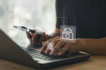 Business professional using laptop and smartphone with digital document management icon, data security, cloud storage, workflow automation concept for modern technology, online business operation.