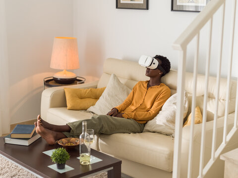 Woman enjoying interactive video in virtual reality headset 