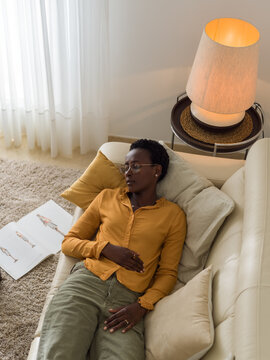 Woman sleeping in living room