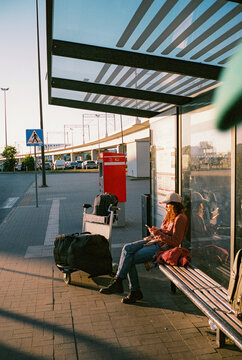 Woman waiting for the bus o nthe station at the airport