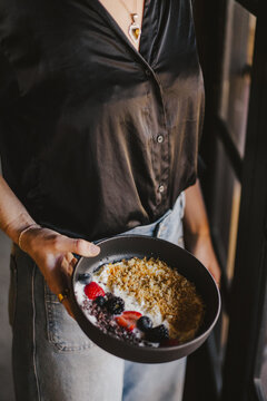 Hand Serving Yogurt Parfait