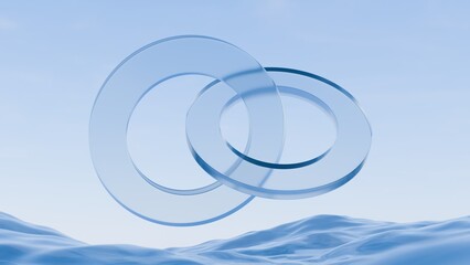 Abstract 3D rendering of interlocking glass rings over blue water