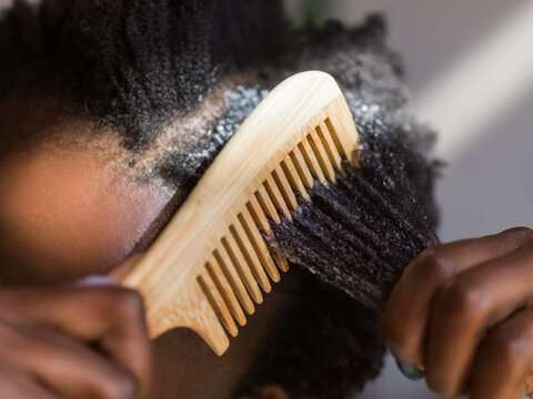 Woman combing her hair 