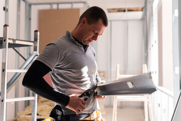 Professional constructing wall at office