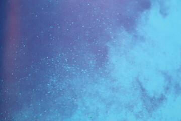 Abstract blue background with water and clouds. Aerial view illustration in white and blue and purple. Illustration of a ground and sky background. Particles, motion and galaxy.