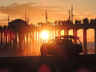 Beautiful beach sunset thru pier