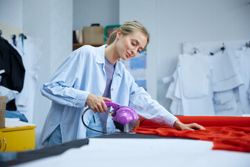 Woman using comprehensive method involving multiple stages to dye textile materials