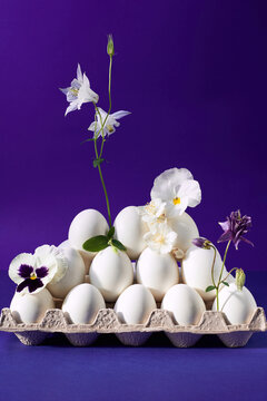 Flowered white eggs on purple backdrop