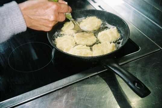 Frying Homemade Potato Pancakes in Hot Oil
