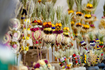 Fototapeta premium Traditional Lithuanian Easter palms known as verbos sold on Kaziukas, Easter market in Vilnius. Lithuanian capital's annual traditional crafts fair held every March on Old Town streets.