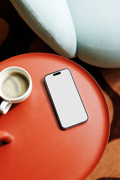 phone Mockup With White Screen And Red Table