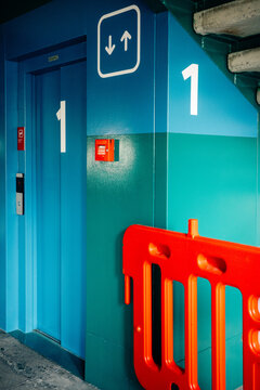 Modern Elevator Entrance With Vibrant Colors and Safety Barriers
