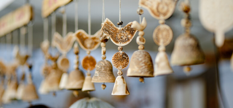 Colorful ceramic bells and other decorations sold on Easter market in Vilnius. Lithuanian capital's annual traditional crafts fair held every March on Old Town streets.