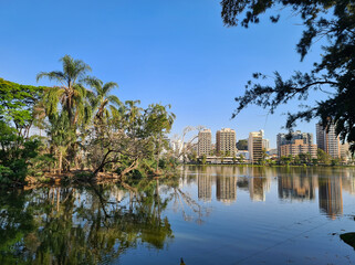 Lake in the water park of the city of S&atilde;o Louren&ccedil;o with residential buildings in the background.