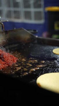 Slow-motion footage of al pastor meat grilling outdoors Taco Stand Series - Food vendor