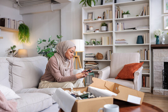 Woman in hijab messaging thank you