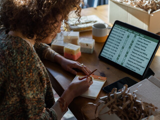 Entrepreneur taking notes while working