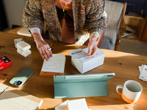Woman managing orders from clients 
