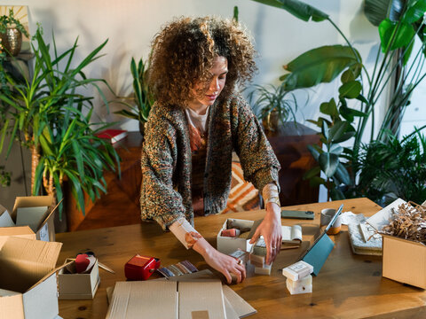 Woman packing order for shipping 