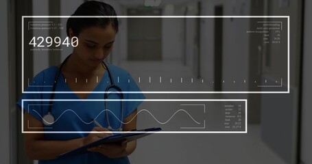 Writing nurse in blue scrubs with clipboard, pen and stethoscope in hospital corridor, HUD 429940