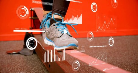 Balancing lower legs in dark leggings, gray shoes blue-laced on beam at gym, with AR overlays