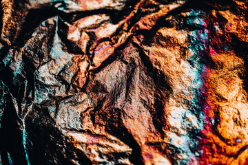 Textured Abstract Wrinkled Foil with Orange and Blue. Glittery multicolored mockup. Copy space