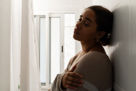 Portrait of sad woman in bathroom