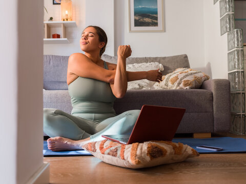 Woman enjoying stretching at home 