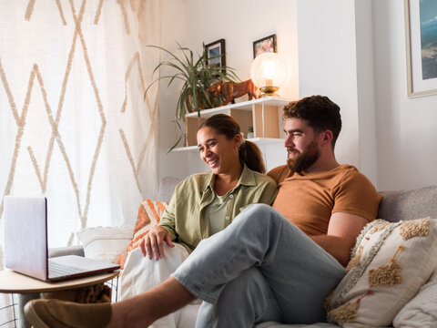Happy couple having video call 