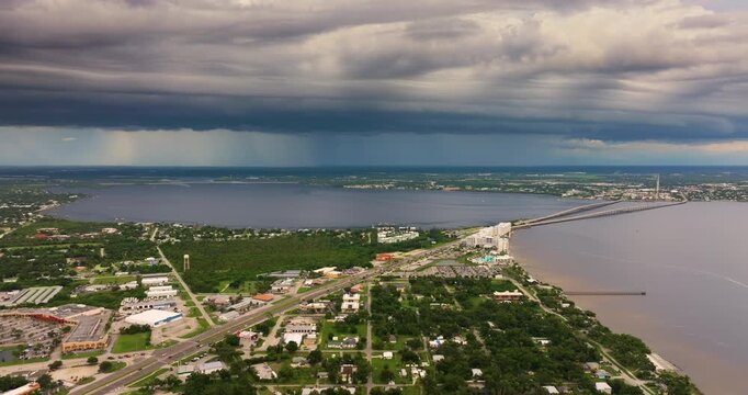 Hurricane season in Florida. Rainstorm sweeping across Charlotte Harbor. Heavy precipitation and moving storm clouds in humid subtropical climate.