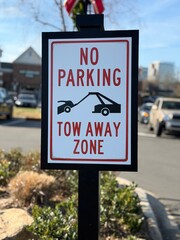 No Parking Tow Away Zone sign with a shallow depth of field