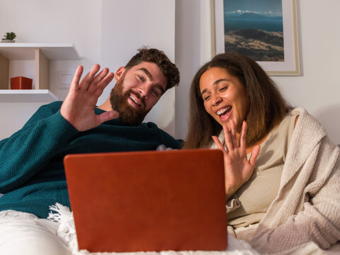 Couple video chatting from home