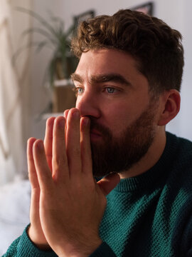 Anxious man in thoughts at home 