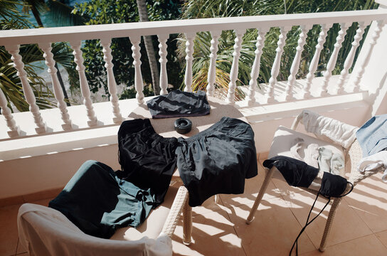 Clothes Drying on a Balcony With a View of Greenery