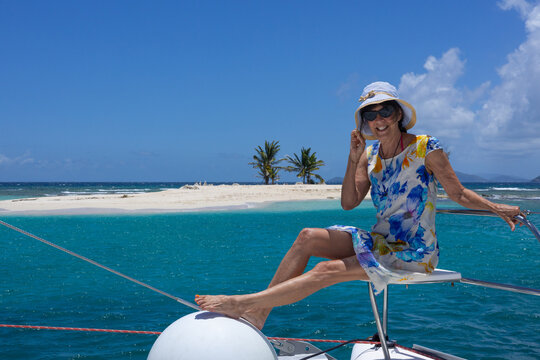 Woman sitting on sailboat Caribbean Ocean 