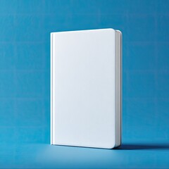 Blank white book on vibrant blue backdrop