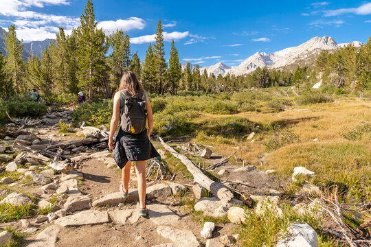 hiker walking on vast trail 