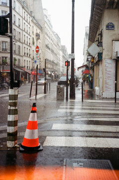 Rainy Street Scene With Traffic Signals and Crosswalk