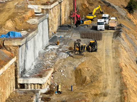 Retaining Wall and Construction Machinery in a Large Building Site