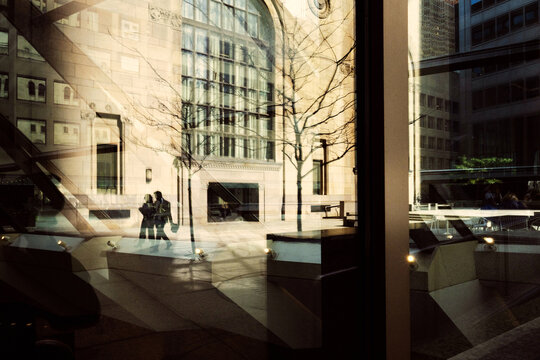 Reflection of couple in the courtyard