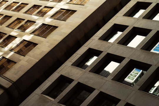 Sunlit concrete and glass patterns