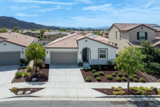 Aerial view of a sprawling neighborhood of family homes in Menifee city in Riverside County, California, United States