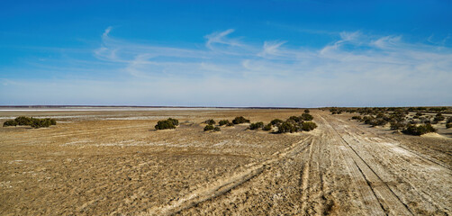 Scenic Desert Landscape with cloudy Blue Sky and wide open space on the road to Lake Eyre