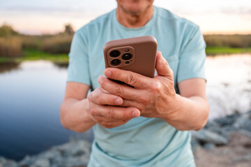 closeup using mobile phone outside