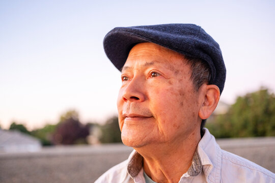 Senior Man Gazing Thoughtfully at the Sunset 