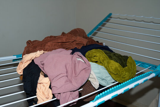 Washed things lie in a heap on the drying rack