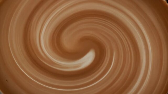 Milk and espresso swirl shot, slow motion, creamy texture, lifestyle caf&eacute; content.
