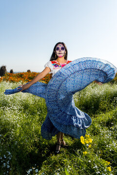 Full-length portrait of model dressed as a traditional Mexican catrina