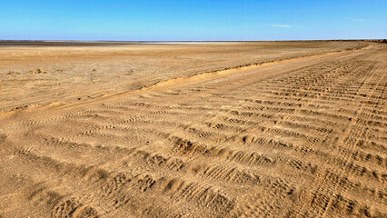 Scenic desert landscape with blue sky on the road to Lake Eyre